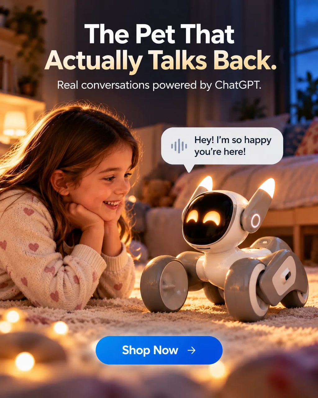 A young girl lies on a carpeted floor in a cozy bedroom setting, smiling at a small white and gray robot toy with glowing eyes and wheels. A speech bubble says, 'Hey! I'm so happy you're here!' Large text at the top reads, 'The Pet That Actually Talks Back.