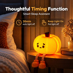 A glowing pumpkin-shaped night light with a sad face and rope legs sits on a bedside table in a bedroom setting. Text at the top reads 'Thoughtful Timing Function' and 'Smart Sleep Assistant,' with feature callouts for 30 min auto light off and keep light on pat light off.